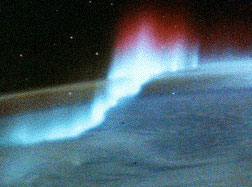 Arc aurora at the south pole with red top