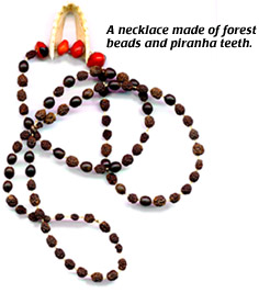 Necklace made of forest beads and piranha teeth