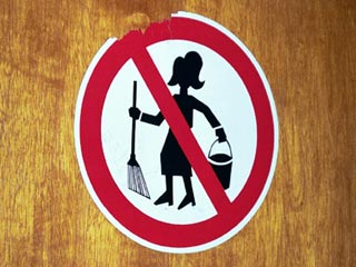 "No cleaning women" sign