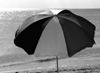 black and white photo of beach umbrella's blue tones