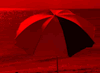 red photo of beach umbrella