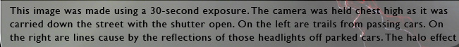 This image was made using a 30 second exposure. The camera was held chest high as it was carried down the street with the shutter open. On the left are trails from passing cars. On the right are lines cause by the reflections of those headlights off parked cars. The halo effect on the upper right is caused by softer architectural lighting.